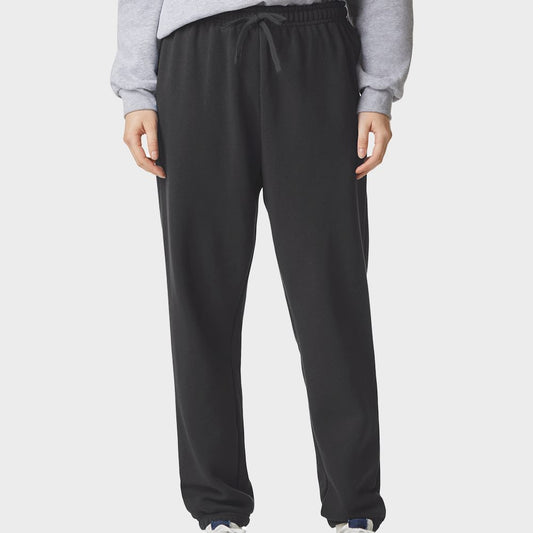 Person wearing black sweatpants on a white background